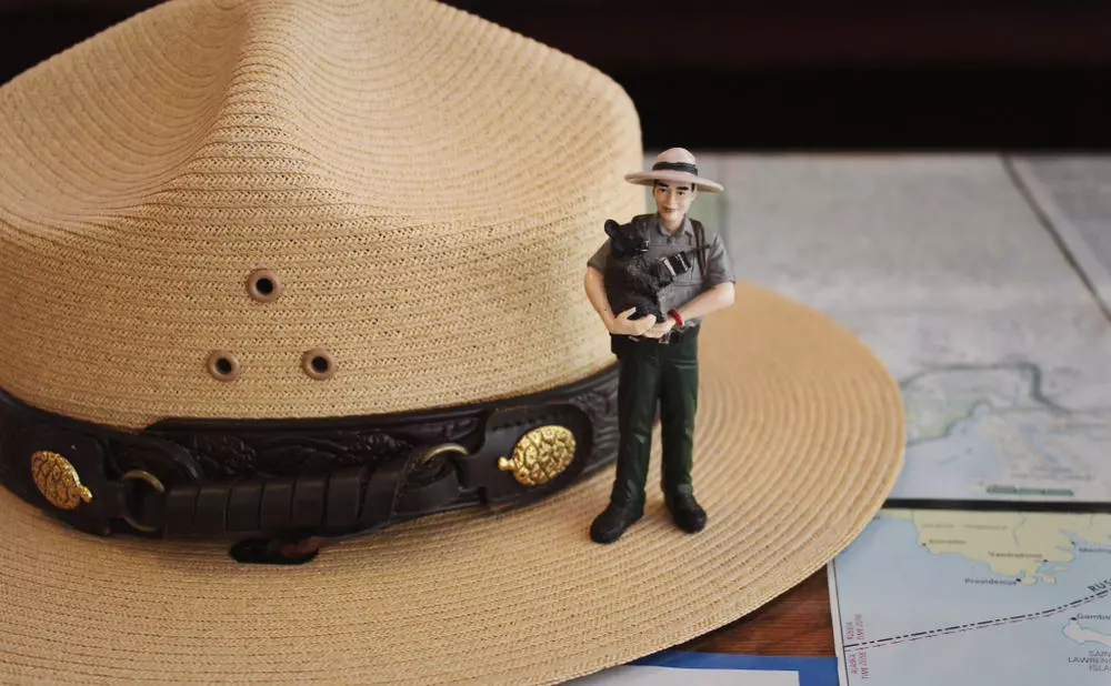 A small action figure of a National Park Ranger represents the Junior Ranger program.